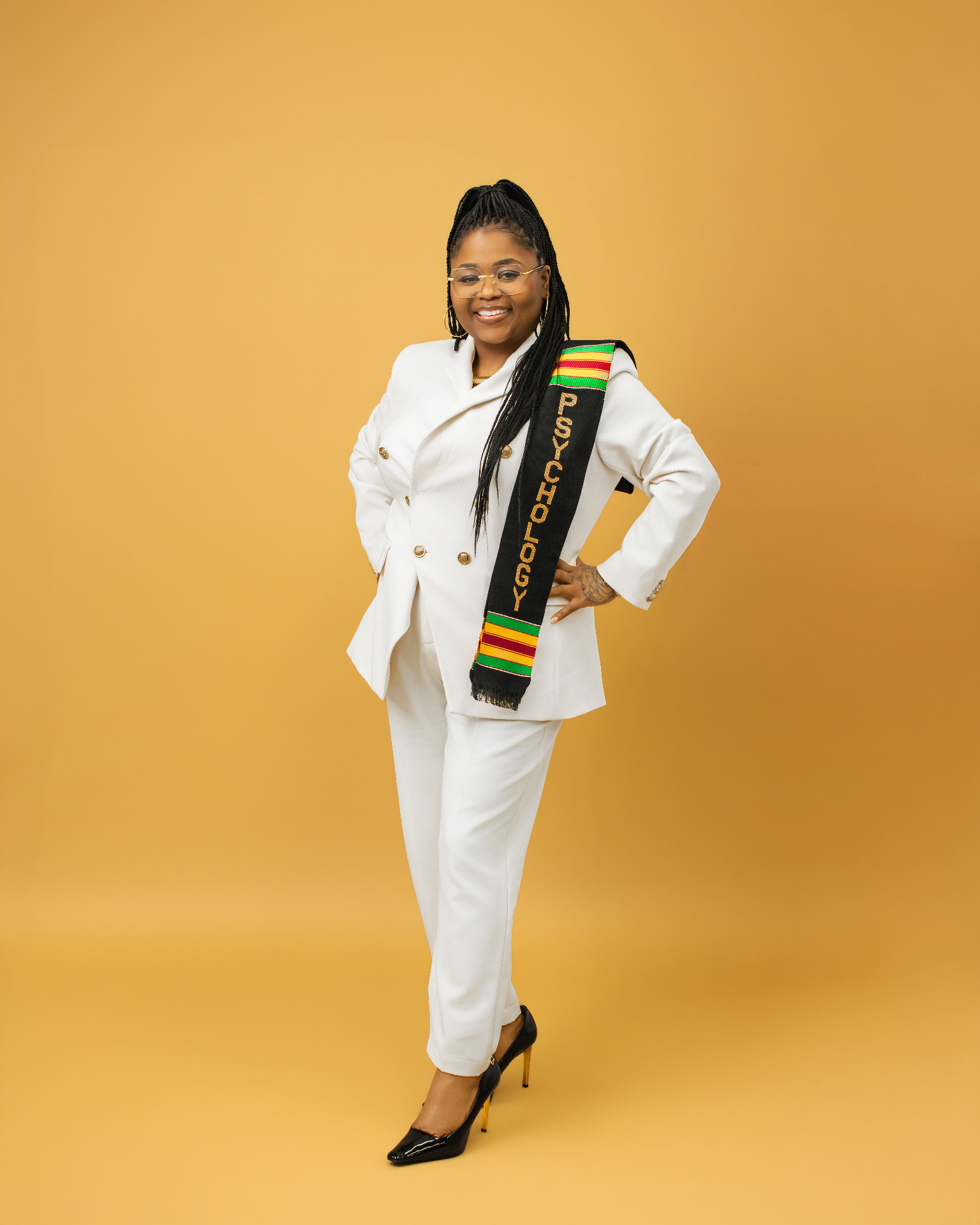 Psychology graduate — yellow backdrop