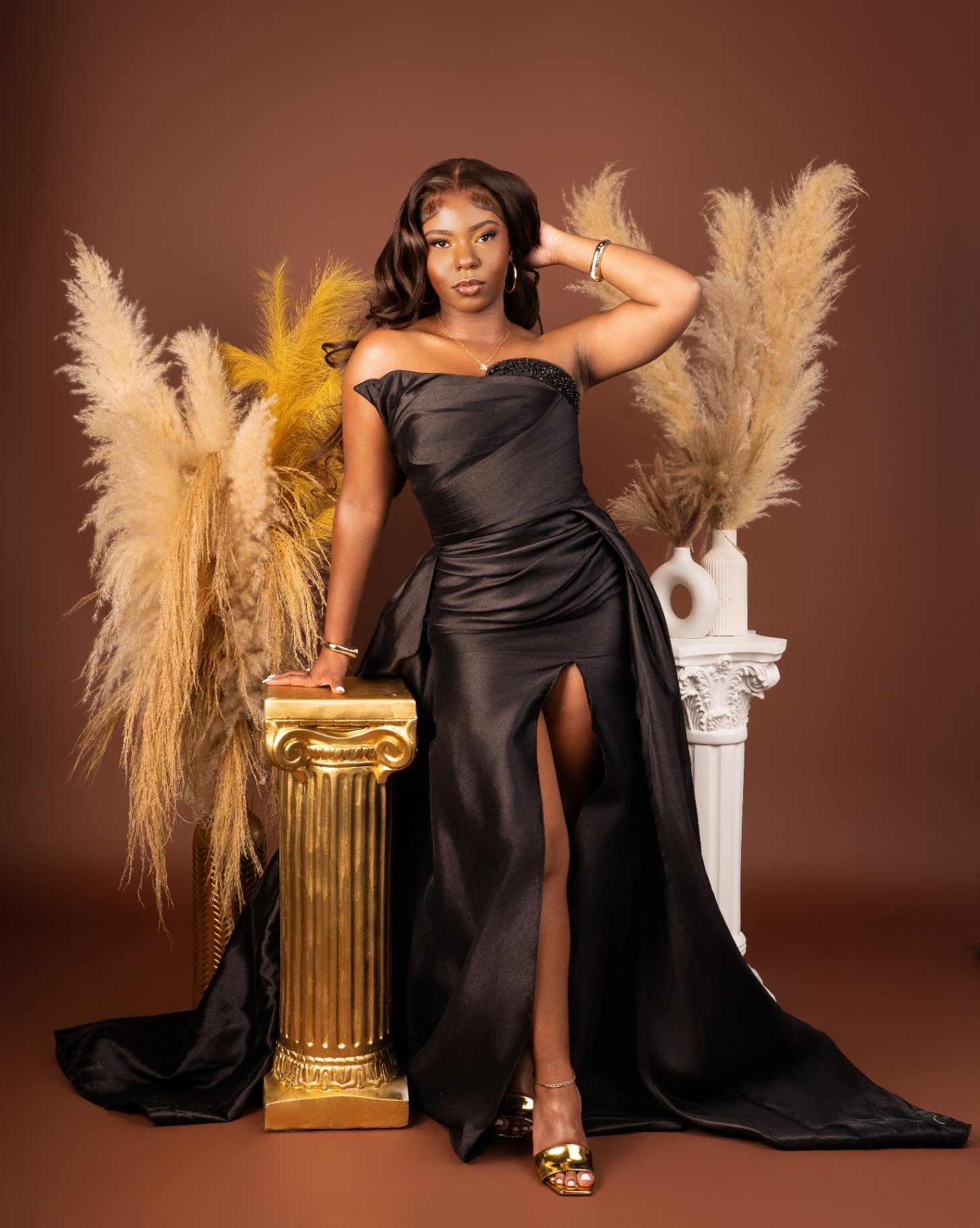 Black satin gown with pampas grass backdrop