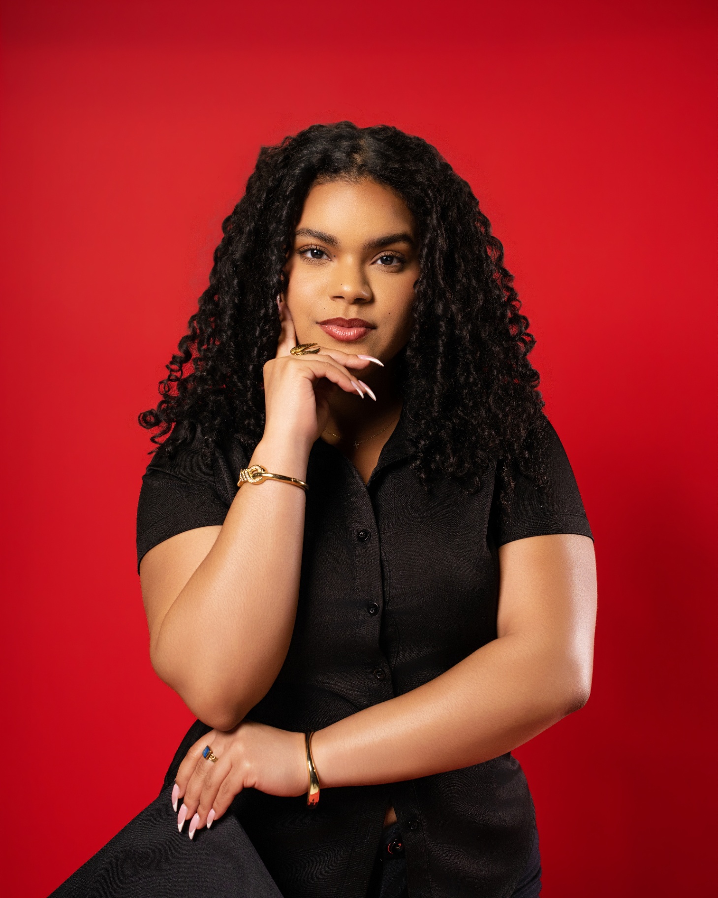 Studio portrait on red backdrop