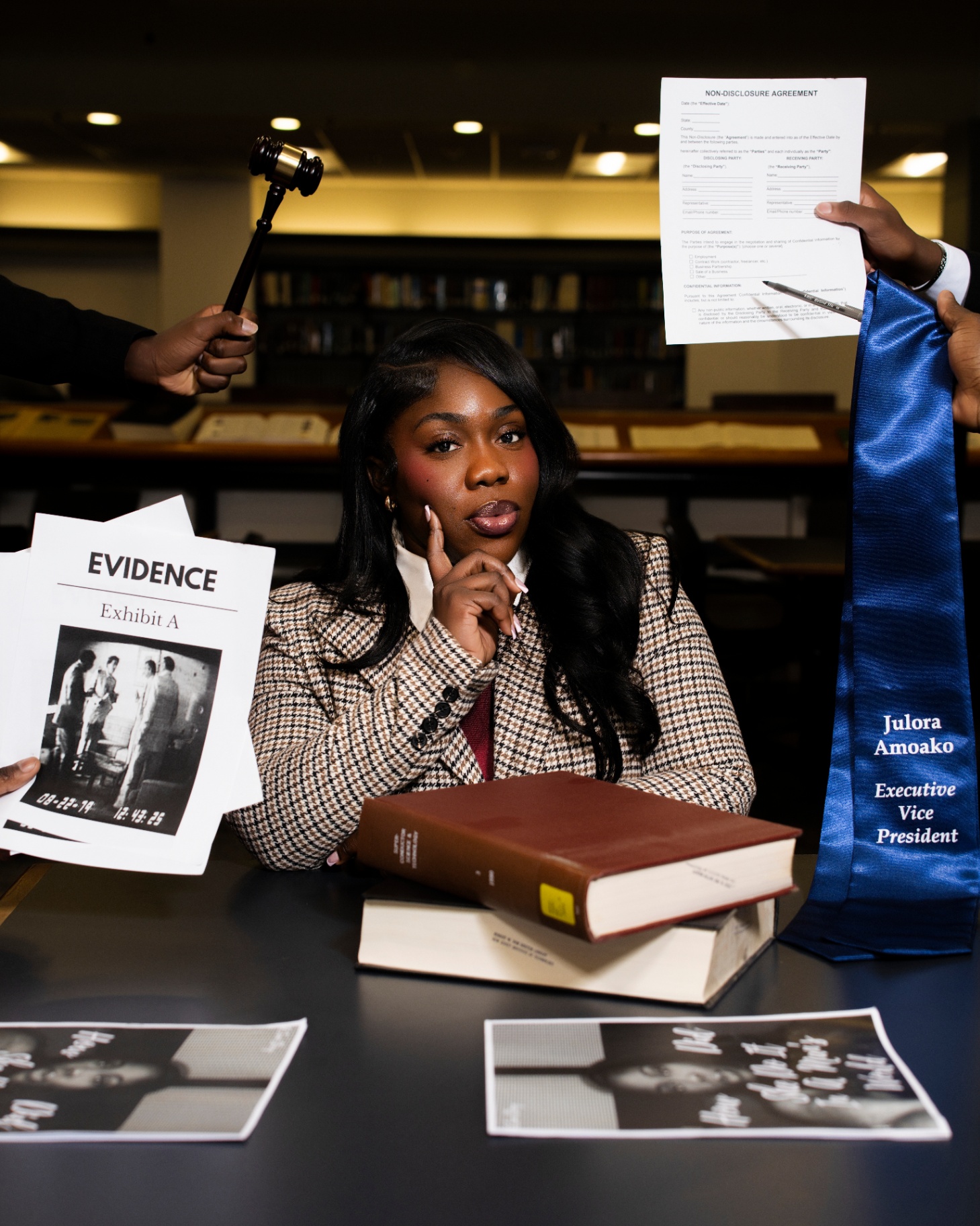 Law-themed grad portrait with gavel and evidence