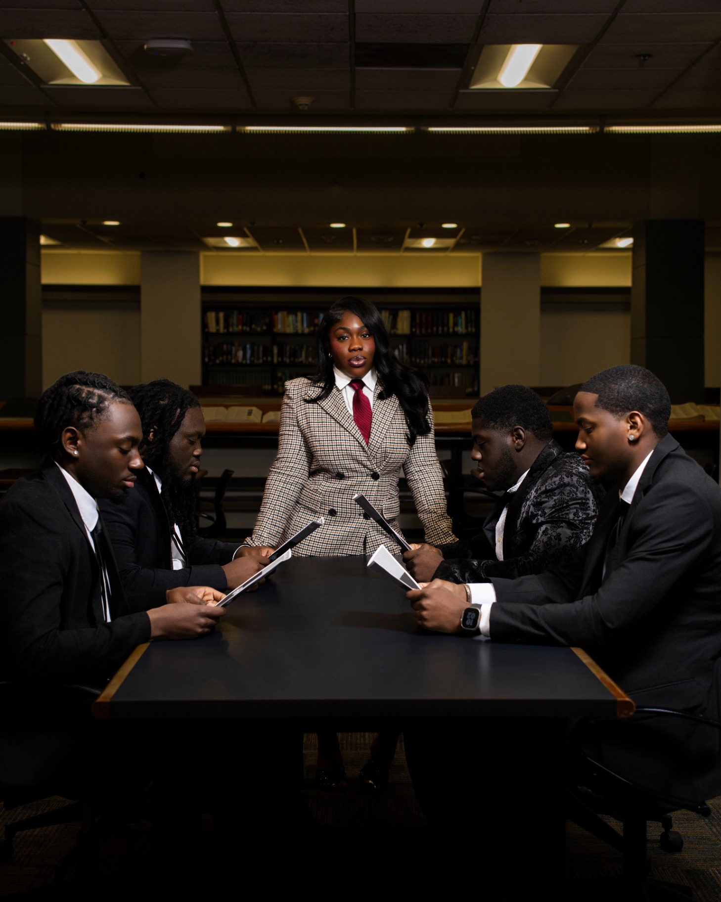 Executive VP grad leading boardroom in library