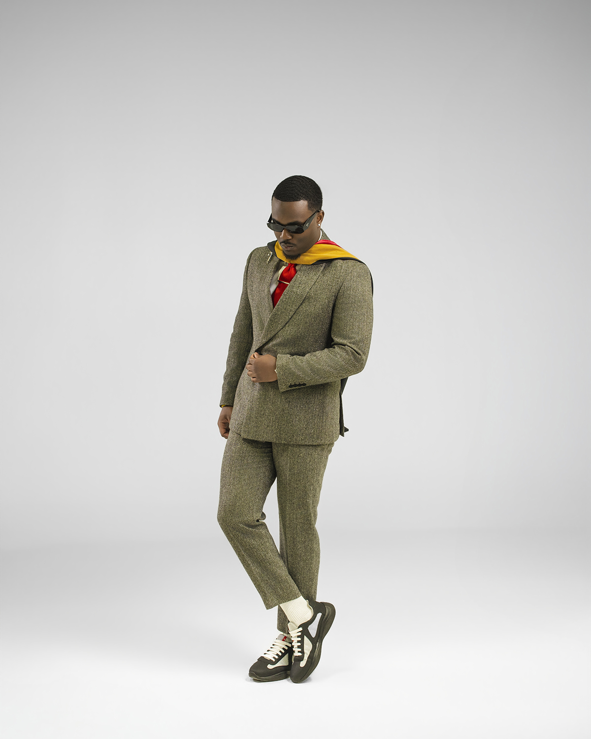 Olive tweed suit full-length studio portrait