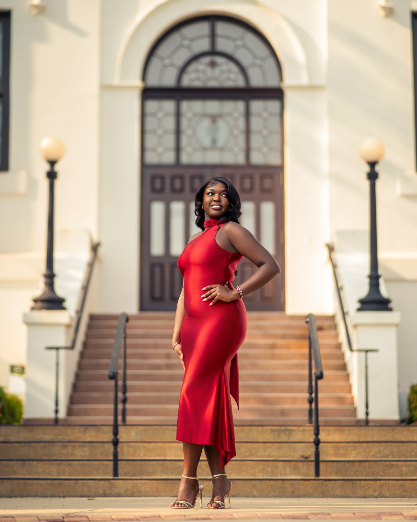 Red dress portrait on historic building steps