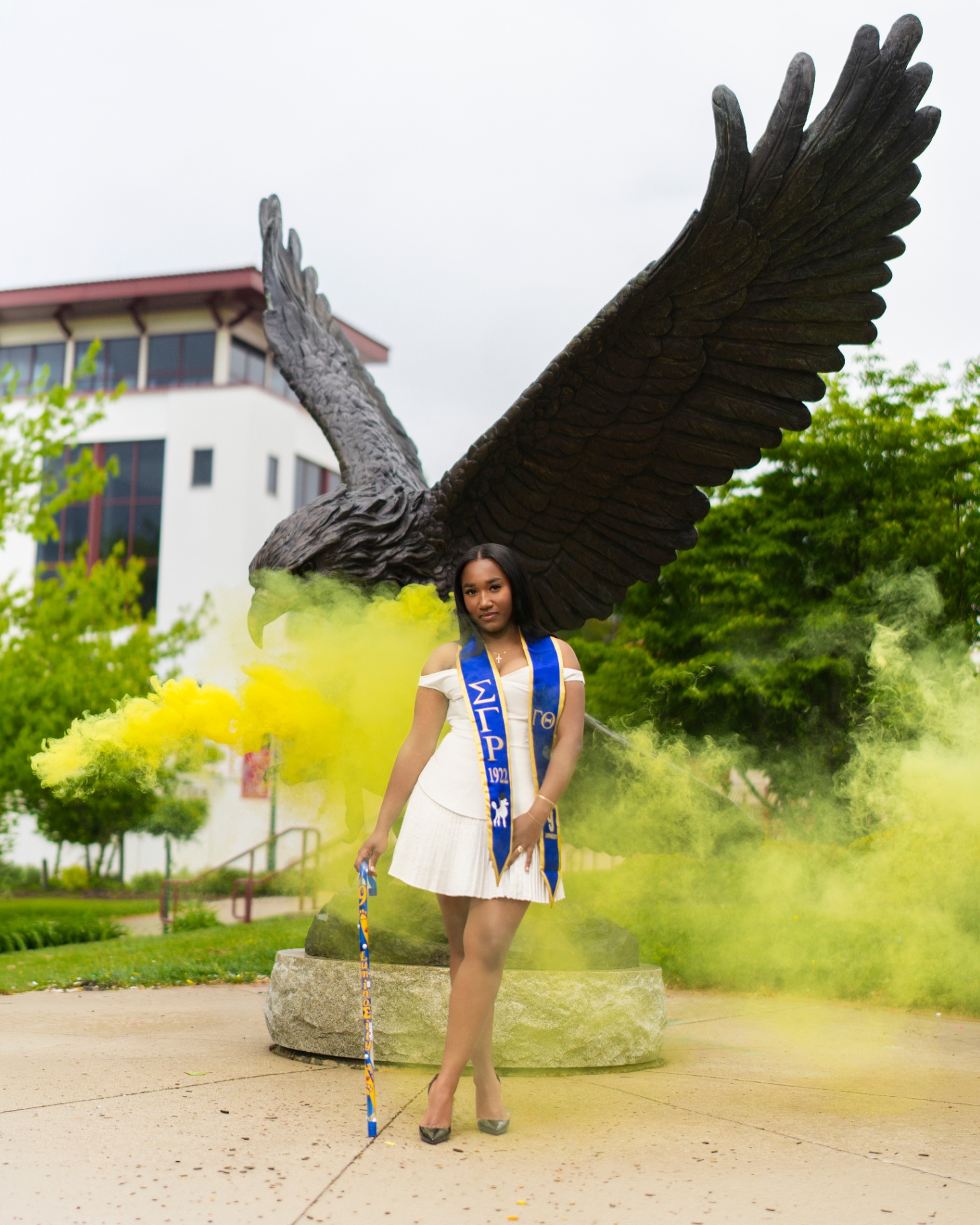 SGRho grad with yellow smoke by eagle statue